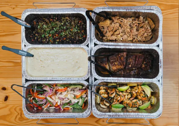 A full catering spread laid out for a wedding reception