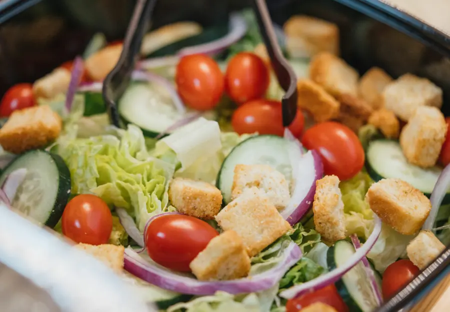 A fresh composed salad with tomatoes and cucumber