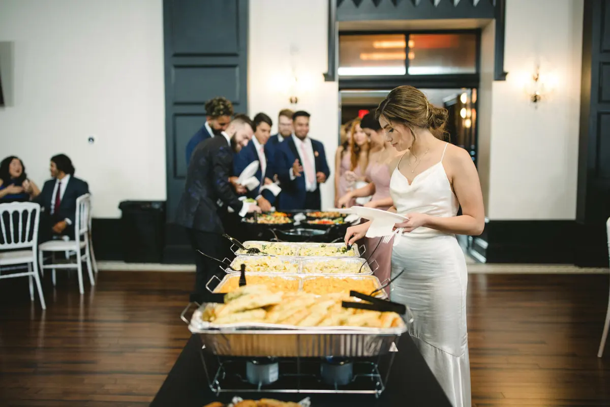 Wedding guests serving themselves from a Nameless Catering buffet line at an Indiana reception